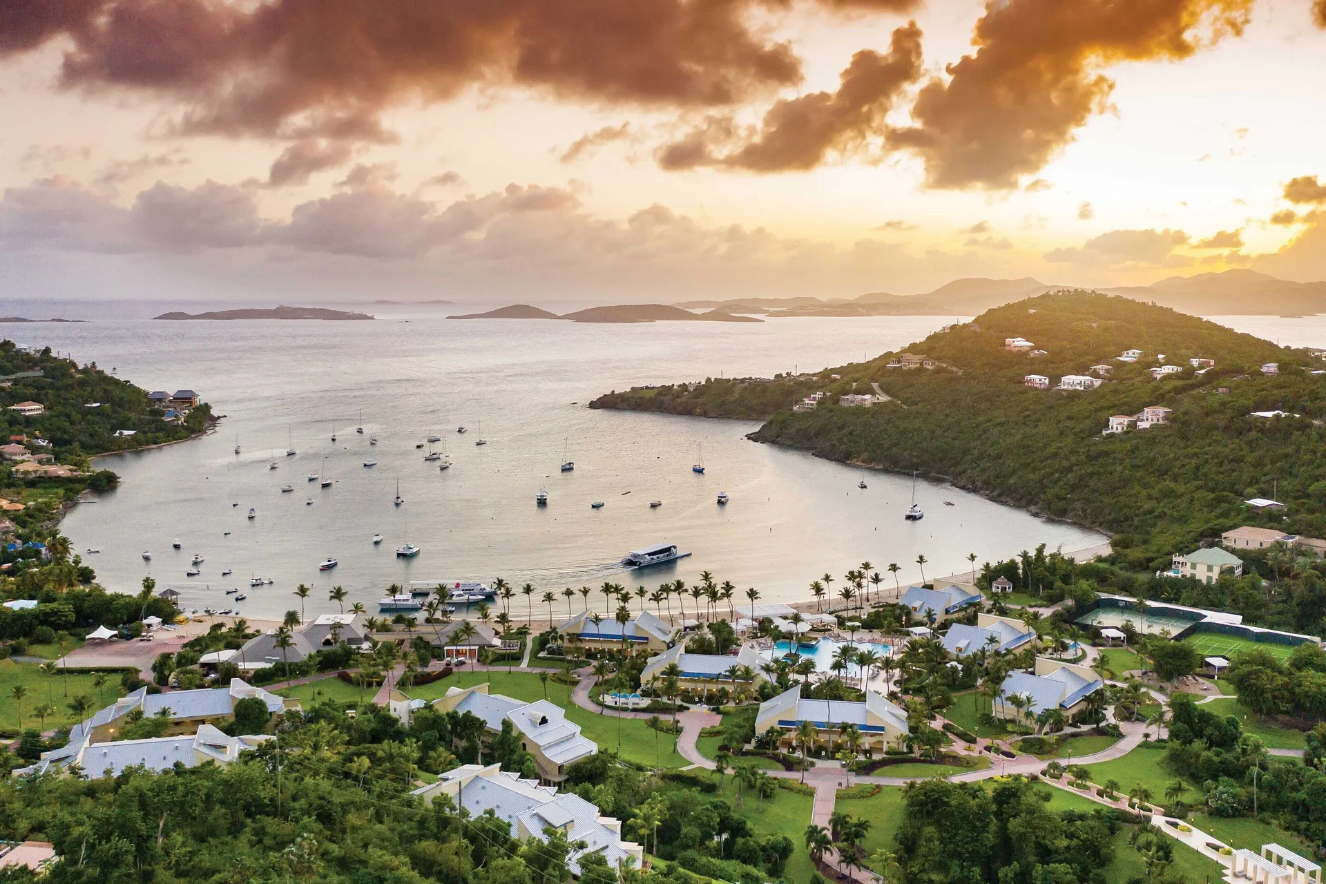 Aerial sunset view of the bay and resort at The Westin St. John Resort Villas.