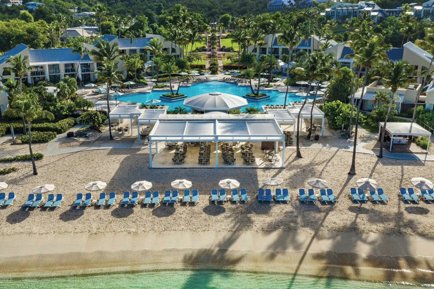 Beach, pool, and lounge chairs at The Westin St. John Resort Villas.