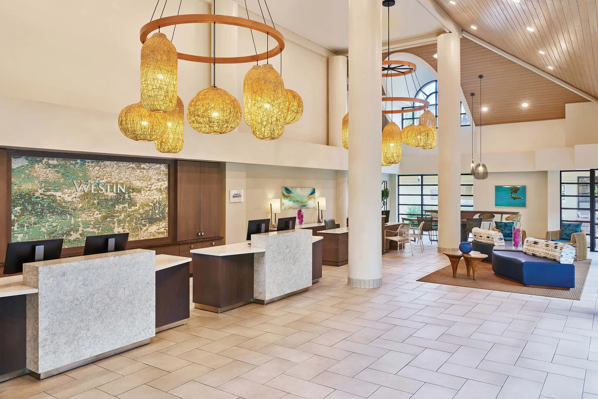 Lobby check-in desks and lounge seating at The Westin St. John Resort Villas.