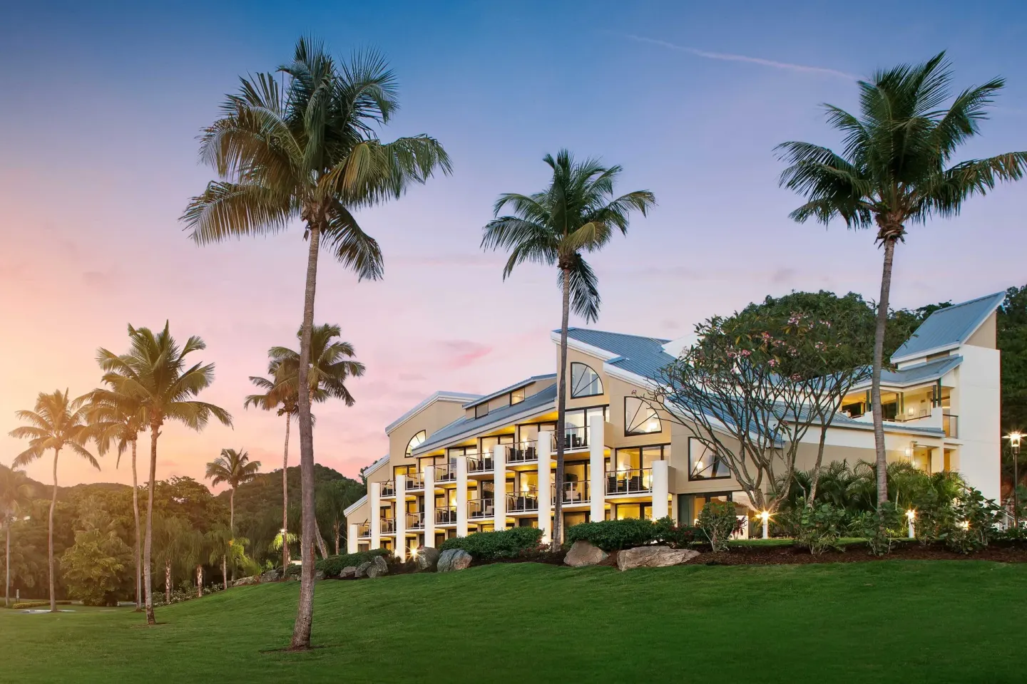 Palm-lined villa building at sunset at The Westin St. John Resort Villas.
