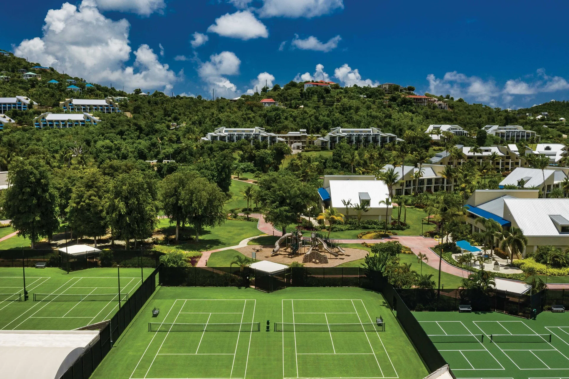 Aerial view of tennis courts and resort grounds at The Westin St. John Resort Villas.