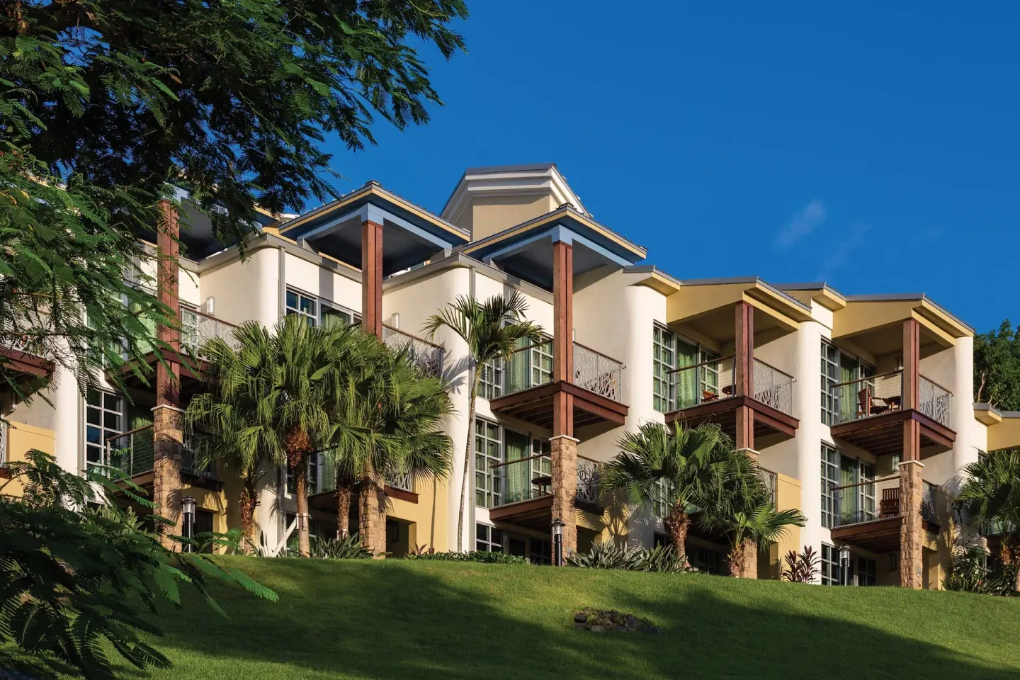 Villa building with balconies and palms at The Westin St. John Resort Villas.