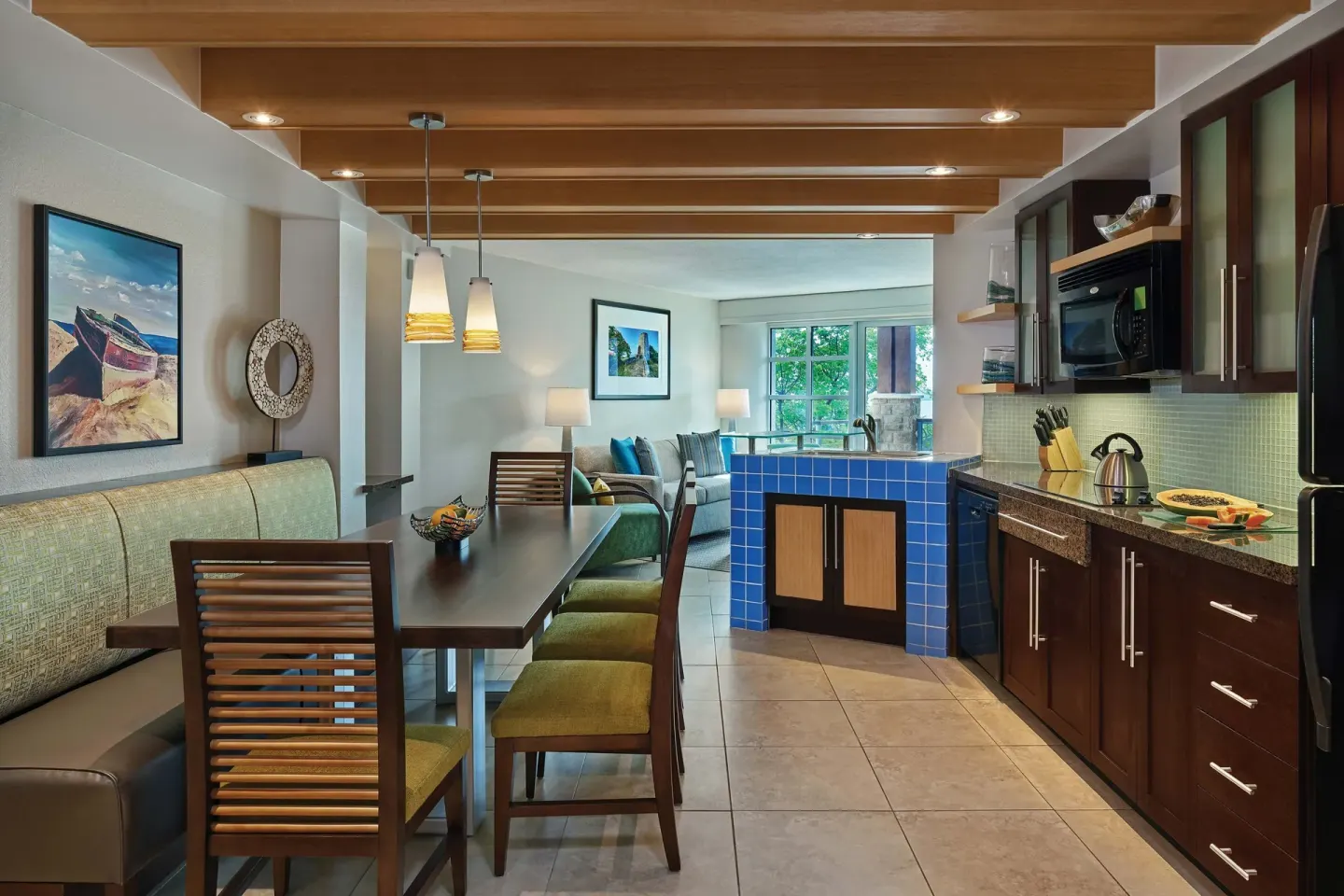 Villa dining area and kitchen with blue-tile island at The Westin St. John Resort Villas.