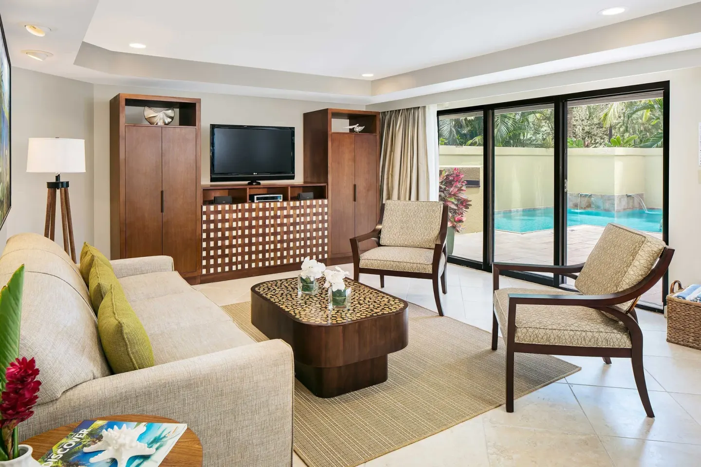 Villa living room with patio pool view at The Westin St. John Resort Villas.