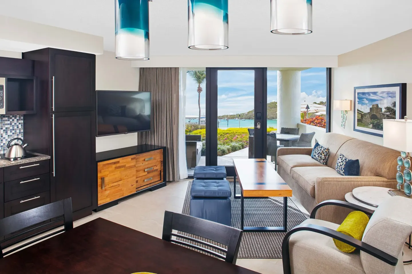 Villa living room with patio doors and water view at The Westin St. John Resort Villas.