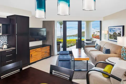 Villa living room with patio doors and water view at The Westin St. John Resort Villas.