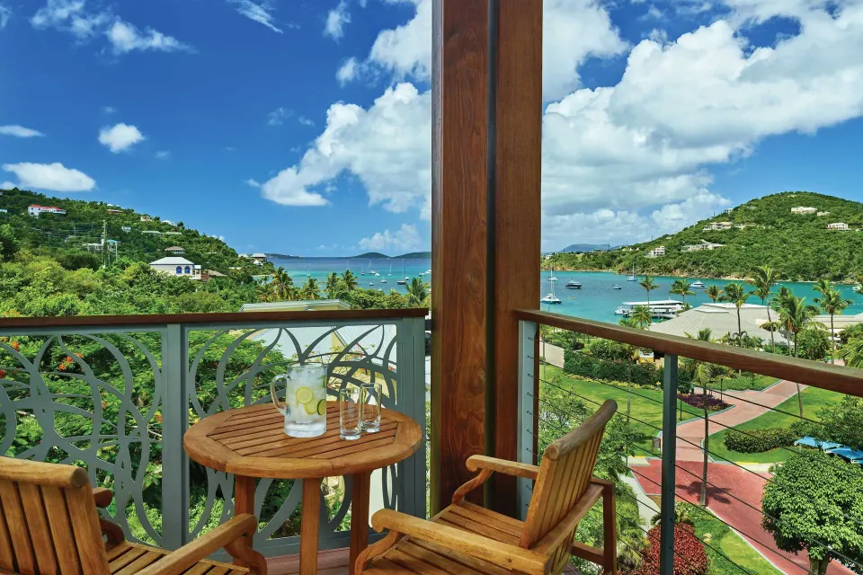 Furnished balcony with bay and hillside views at The Westin St. John Resort Villas.