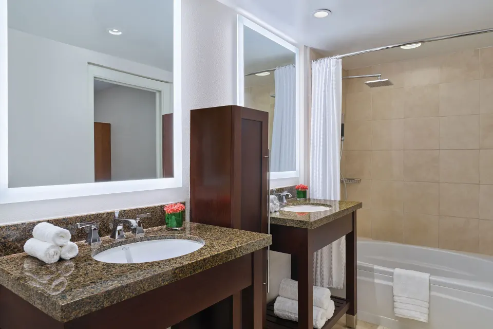 Loft bathroom with dual vanities and tub-shower area at The Westin St. John Resort Villas.