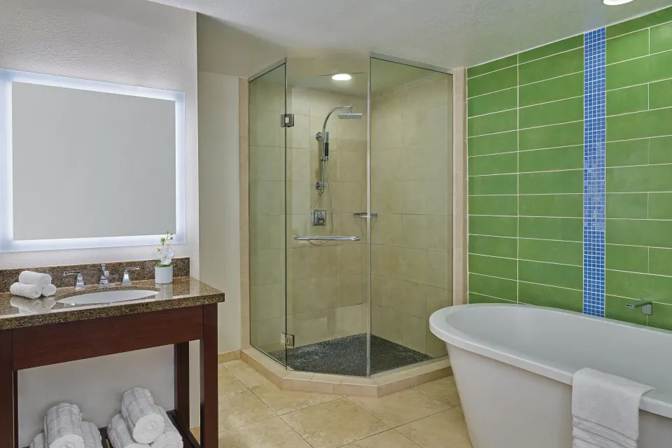 Loft bathroom with vanity, glass shower, and soaking tub at The Westin St. John Resort Villas.