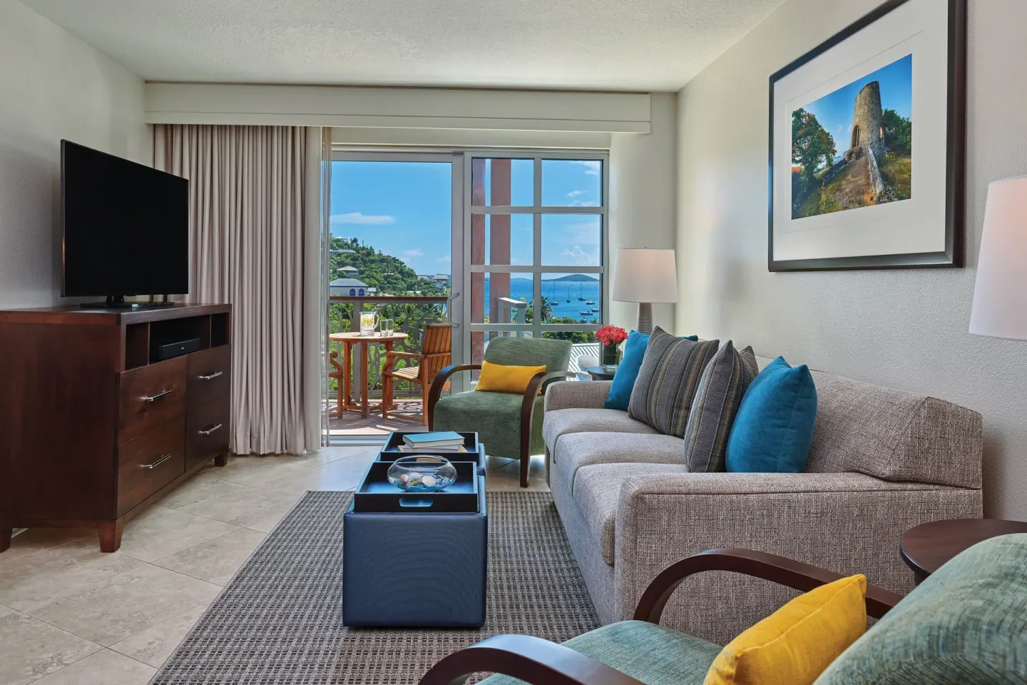 Loft living room with sofa, TV, and balcony doors at The Westin St. John Resort Villas.