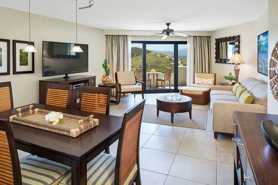 Resort-view villa dining and living room with balcony at The Westin St. John Resort Villas.