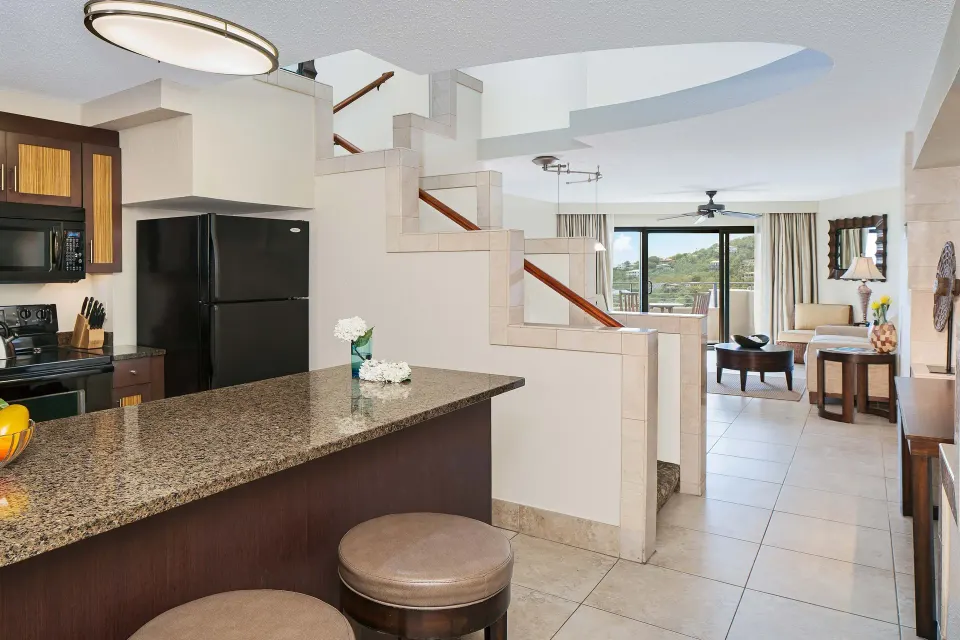 Two-bedroom resort-view villa kitchen, staircase, and living area at The Westin St. John Resort Villas.