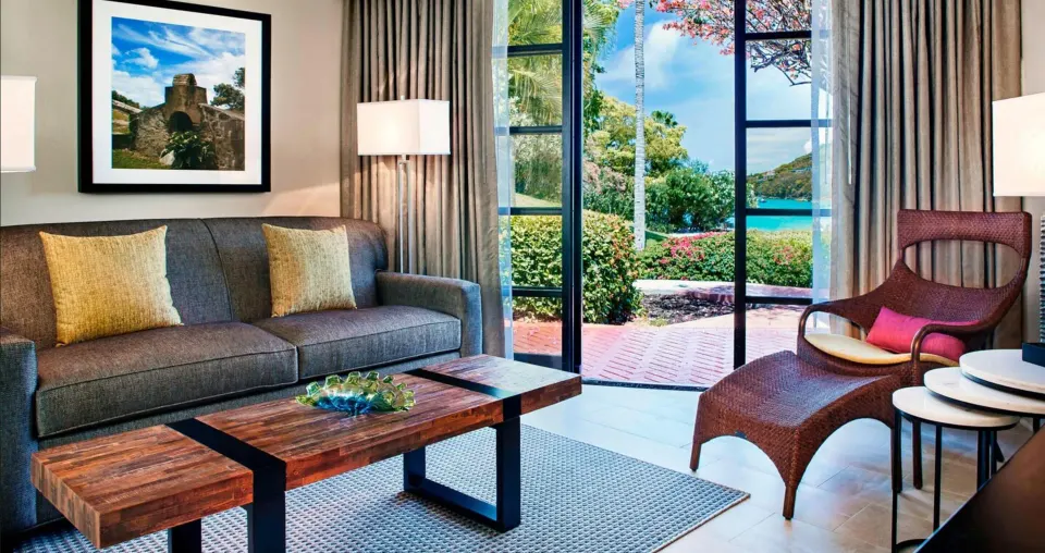 Studio sitting area with sofa bed and patio doors at The Westin St. John Resort Villas.