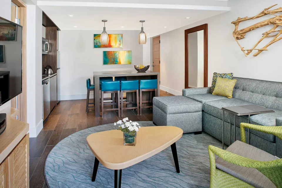 Villa living room with sofa and kitchen island at The Westin St. John Resort Villas.