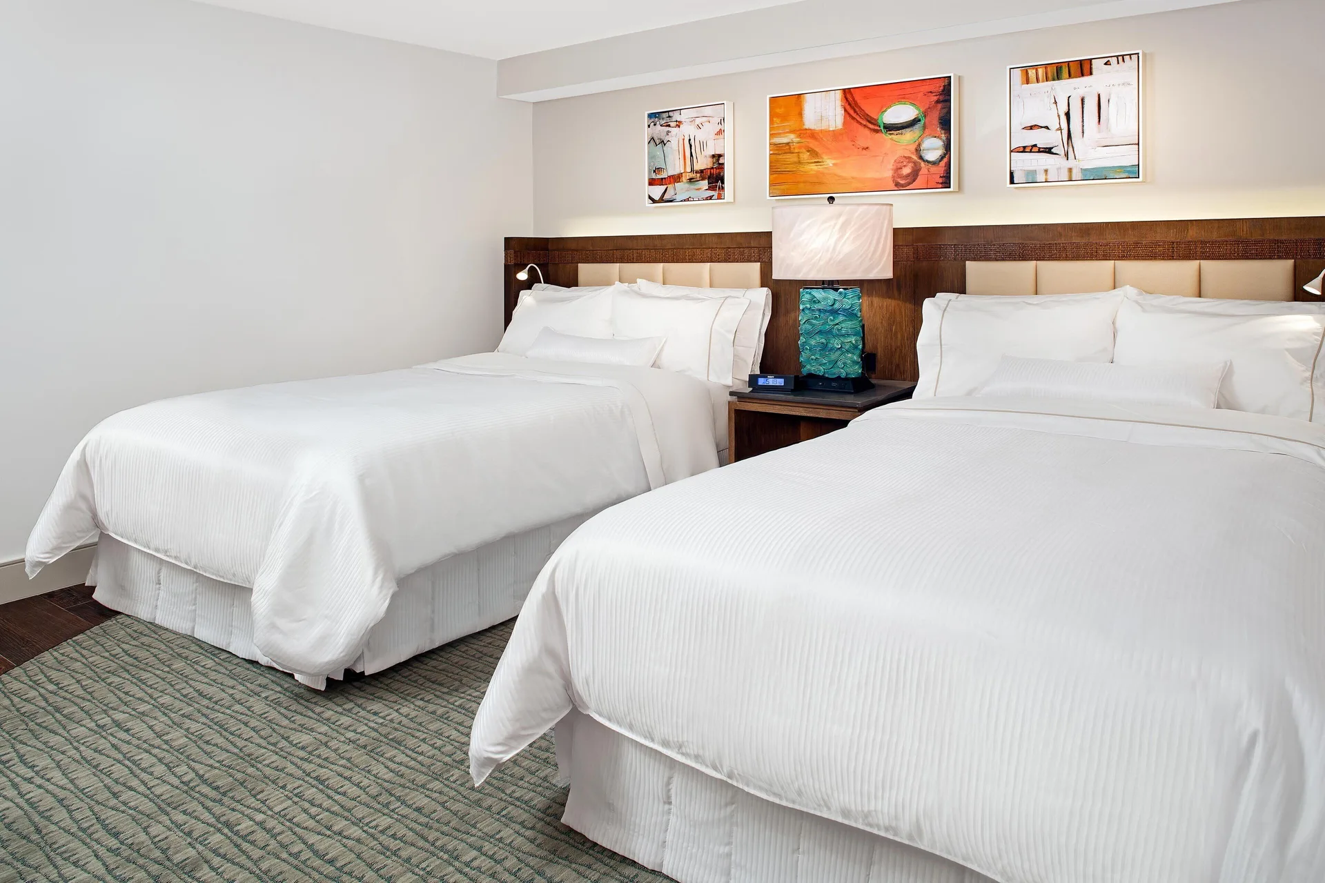 Two white beds in a guest room at The Westin St. John Resort Villas.