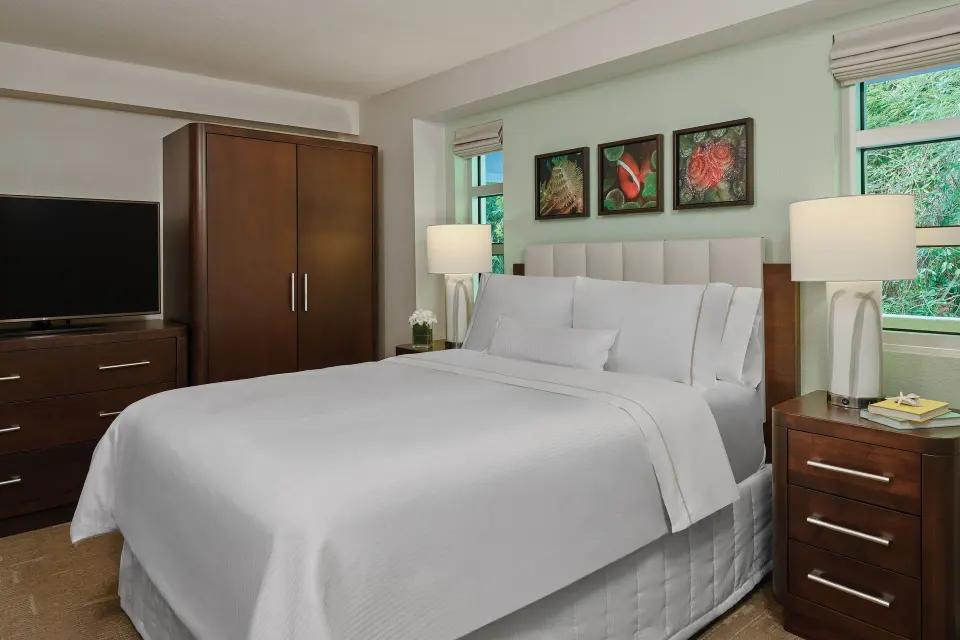 Three-bedroom resort view villa bedroom with wood furnishings at The Westin St. John Resort Villas.