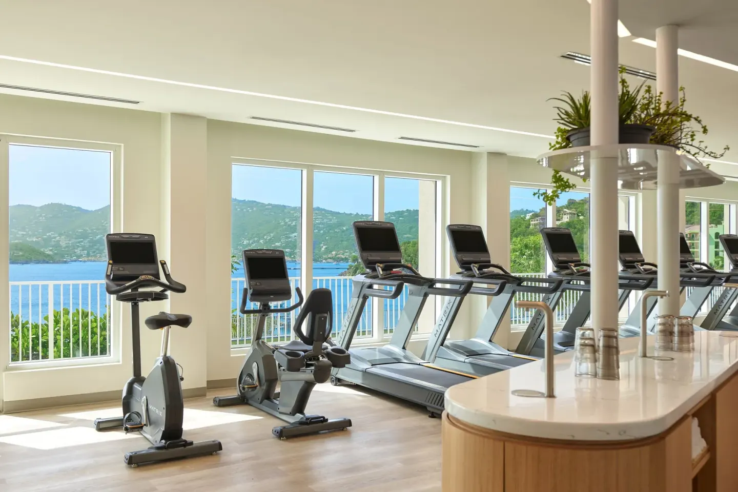 Fitness room cardio machines with harbor views at The Westin St. Thomas Beach Resort & Spa.