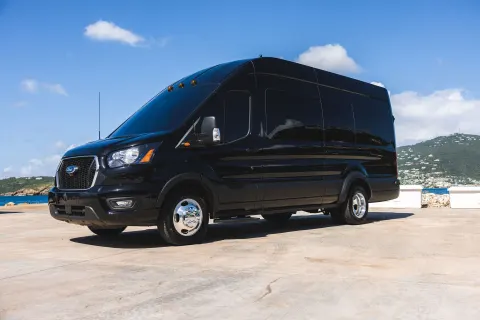 Black passenger van parked by the water at The Westin St. Thomas Beach Resort & Spa.