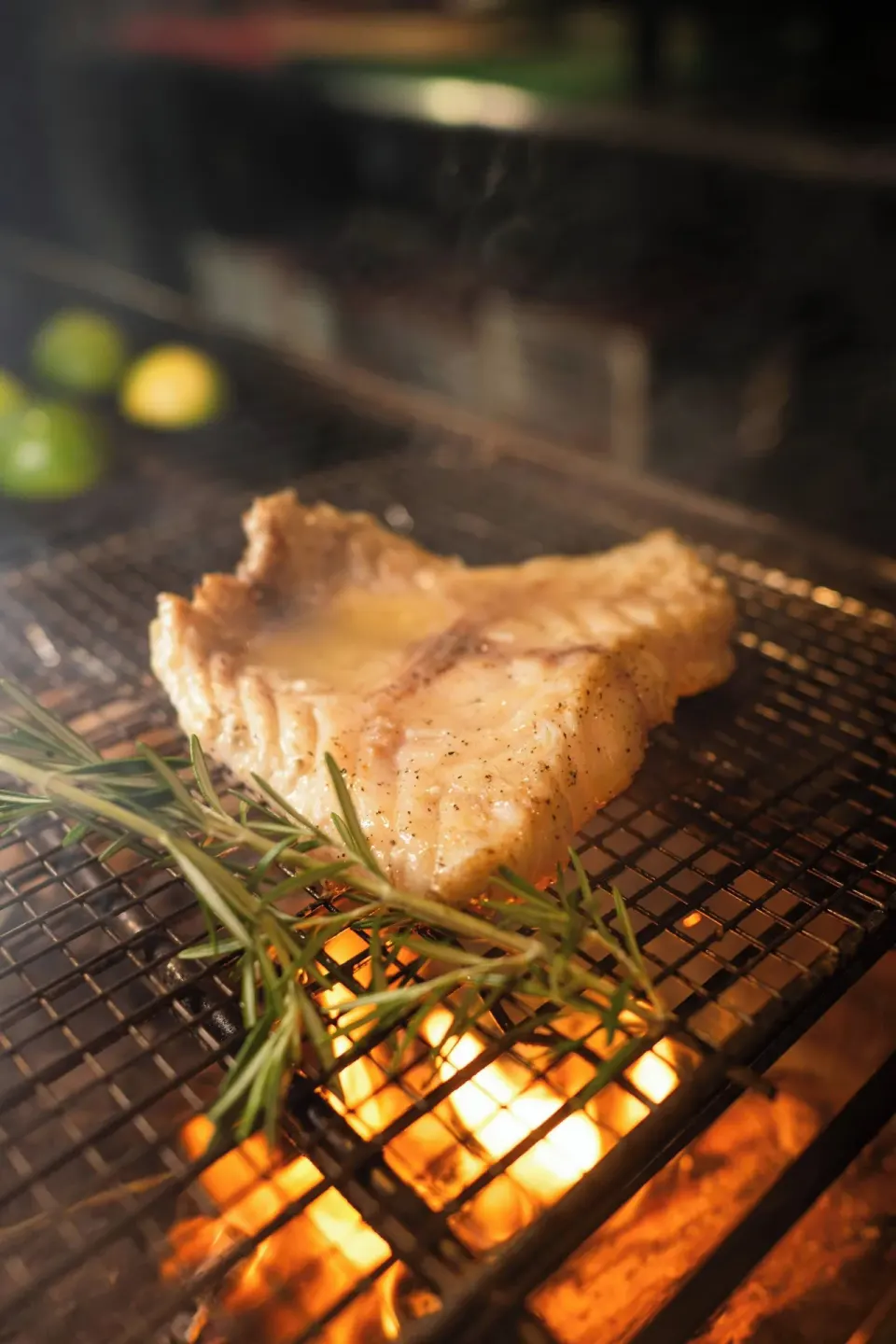 A grilled fish fillet cooks with rosemary at The Westin St. Thomas Beach Resort & Spa.