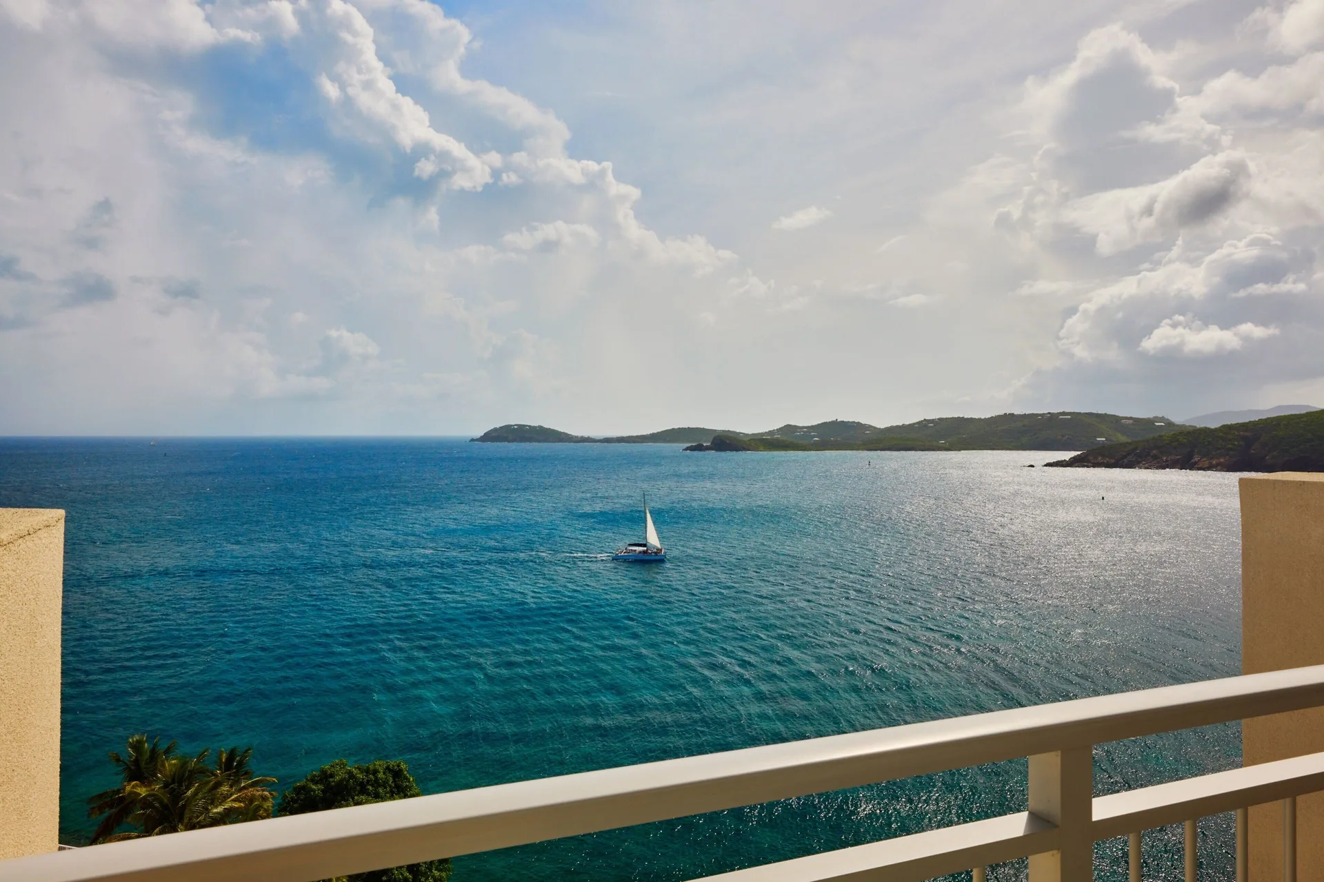 Balcony ocean view with a sailboat at The Westin St. Thomas Beach Resort & Spa.