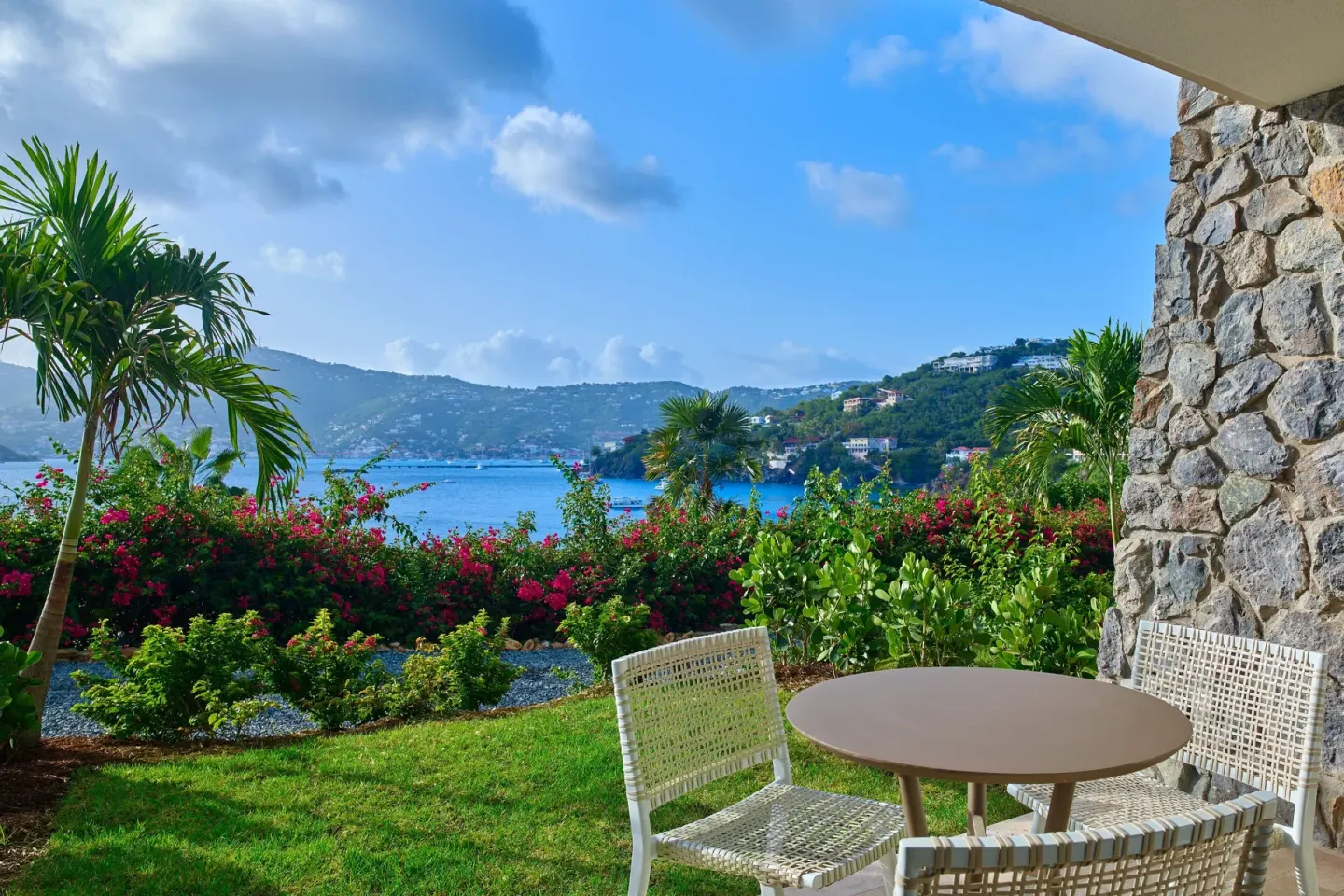 Terrace seating with ocean and hillside views at The Westin St. Thomas Beach Resort & Spa.