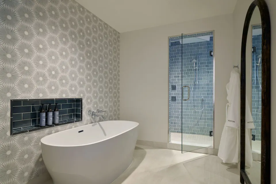 Suite bathroom with freestanding tub and glass shower at The Westin St. Thomas Beach Resort & Spa.