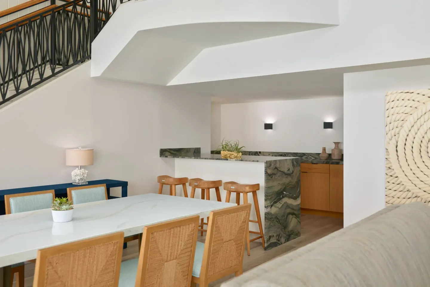 Dining table and wet bar in a balcony suite at The Westin St. Thomas Beach Resort & Spa.
