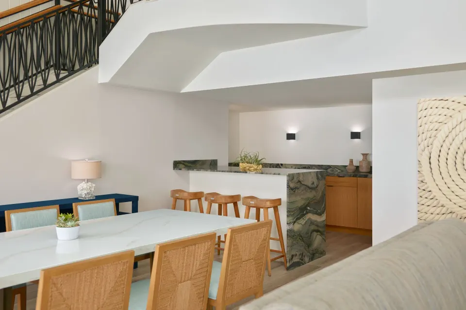 Dining table and wet bar in a balcony suite at The Westin St. Thomas Beach Resort & Spa.