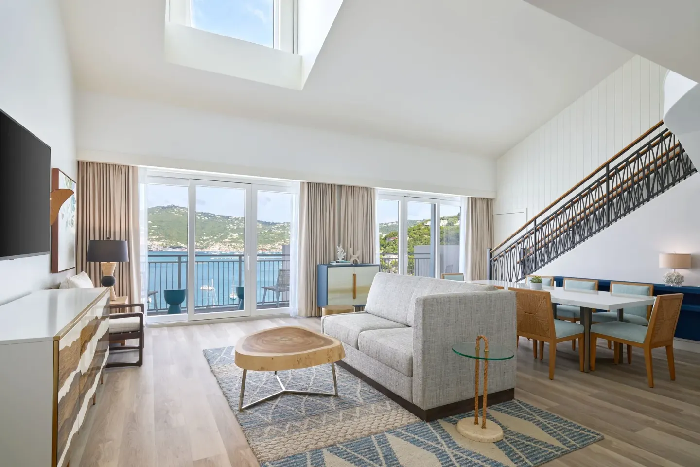One-bedroom balcony suite living area with harbor views at The Westin St. Thomas Beach Resort & Spa.