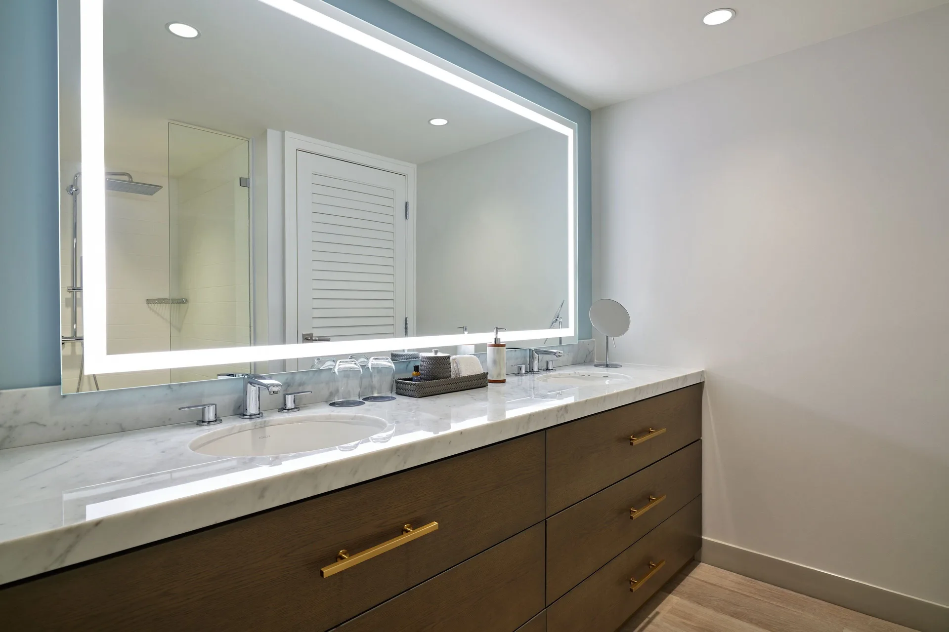 Suite bathroom vanity with illuminated mirror at The Westin St. Thomas Beach Resort & Spa.