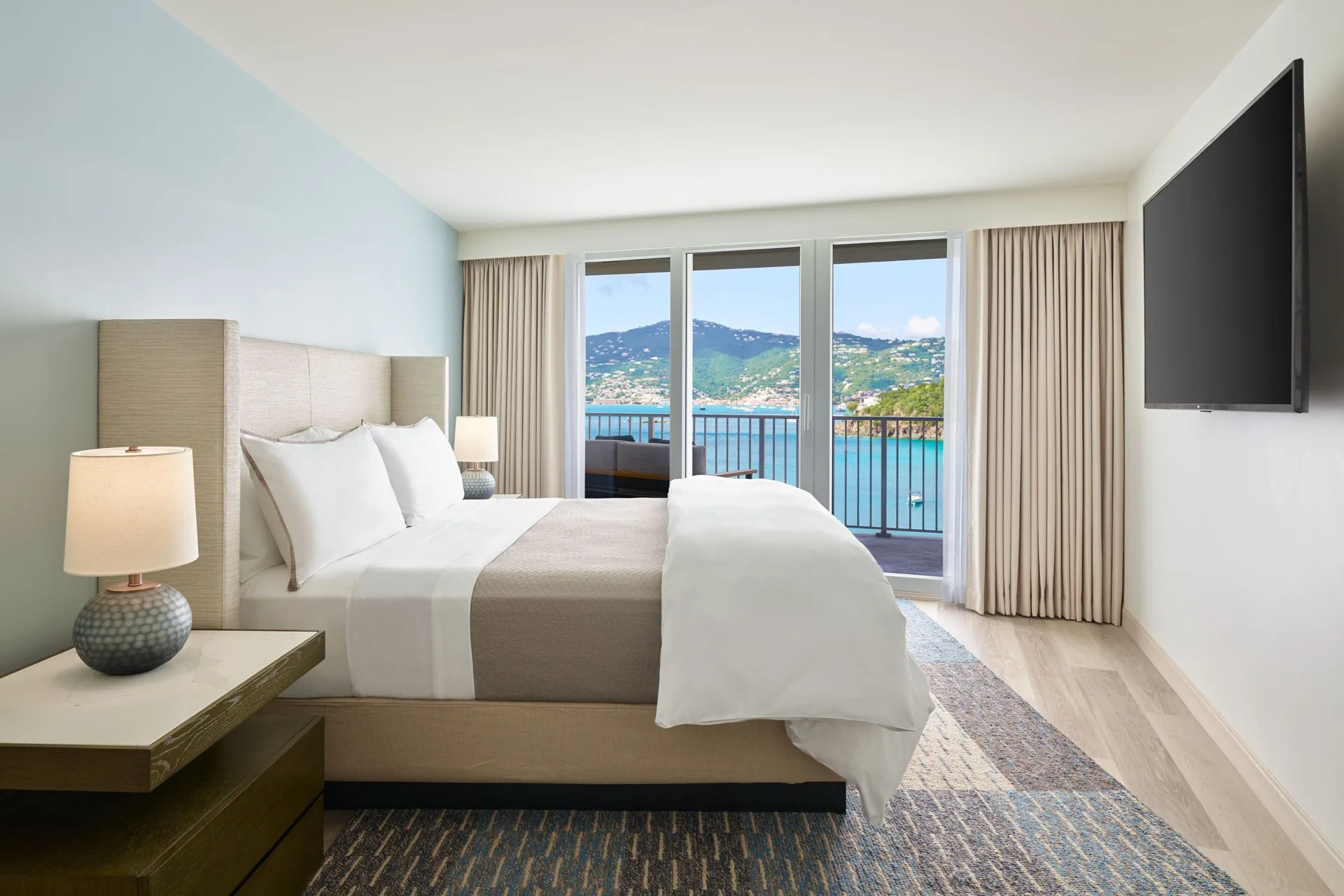 King bedroom with balcony ocean view at The Westin St. Thomas Beach Resort & Spa.