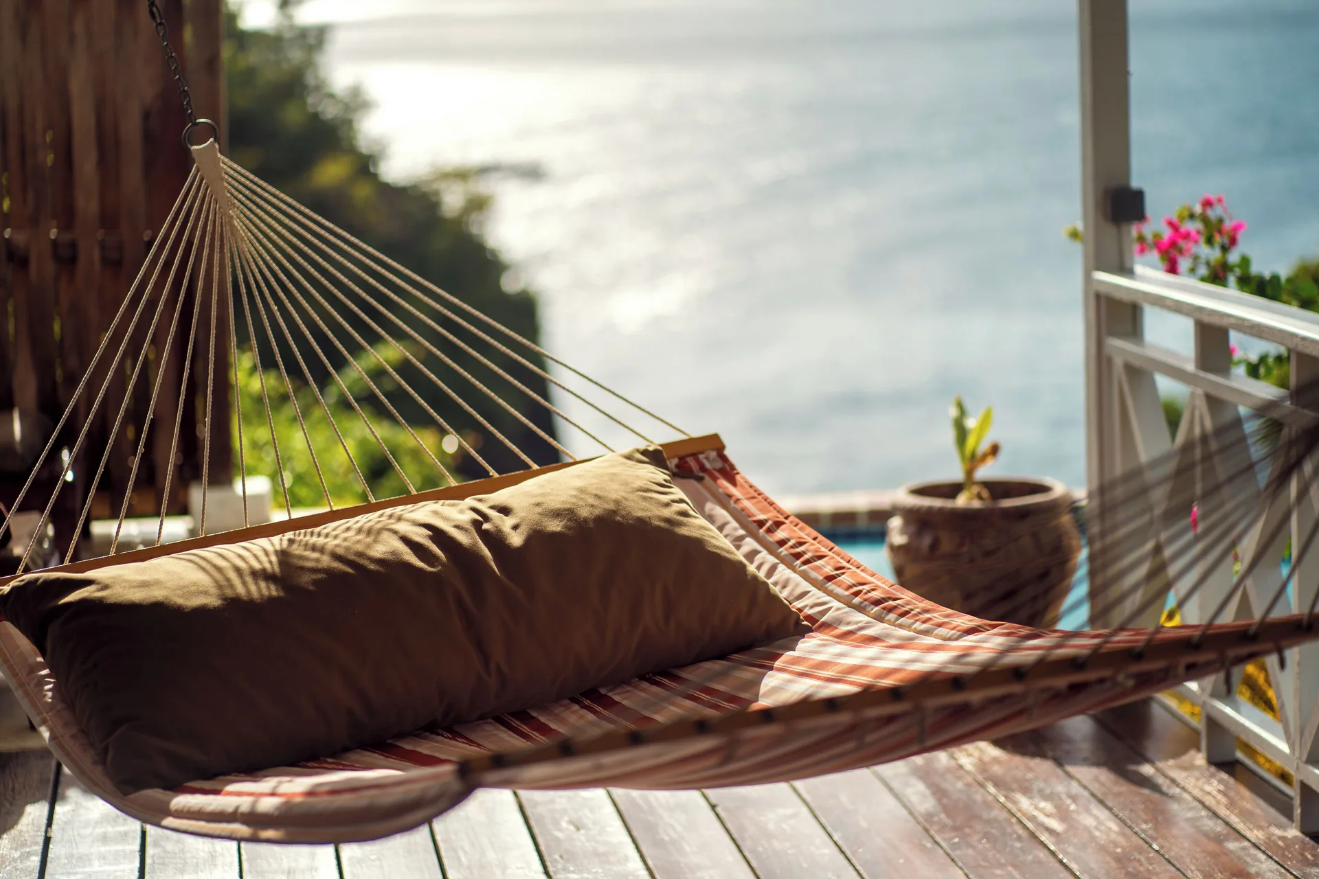 Ocean View Cottage hammock on a wooden veranda overlooking the sea at Ti Kaye Resort & Spa.