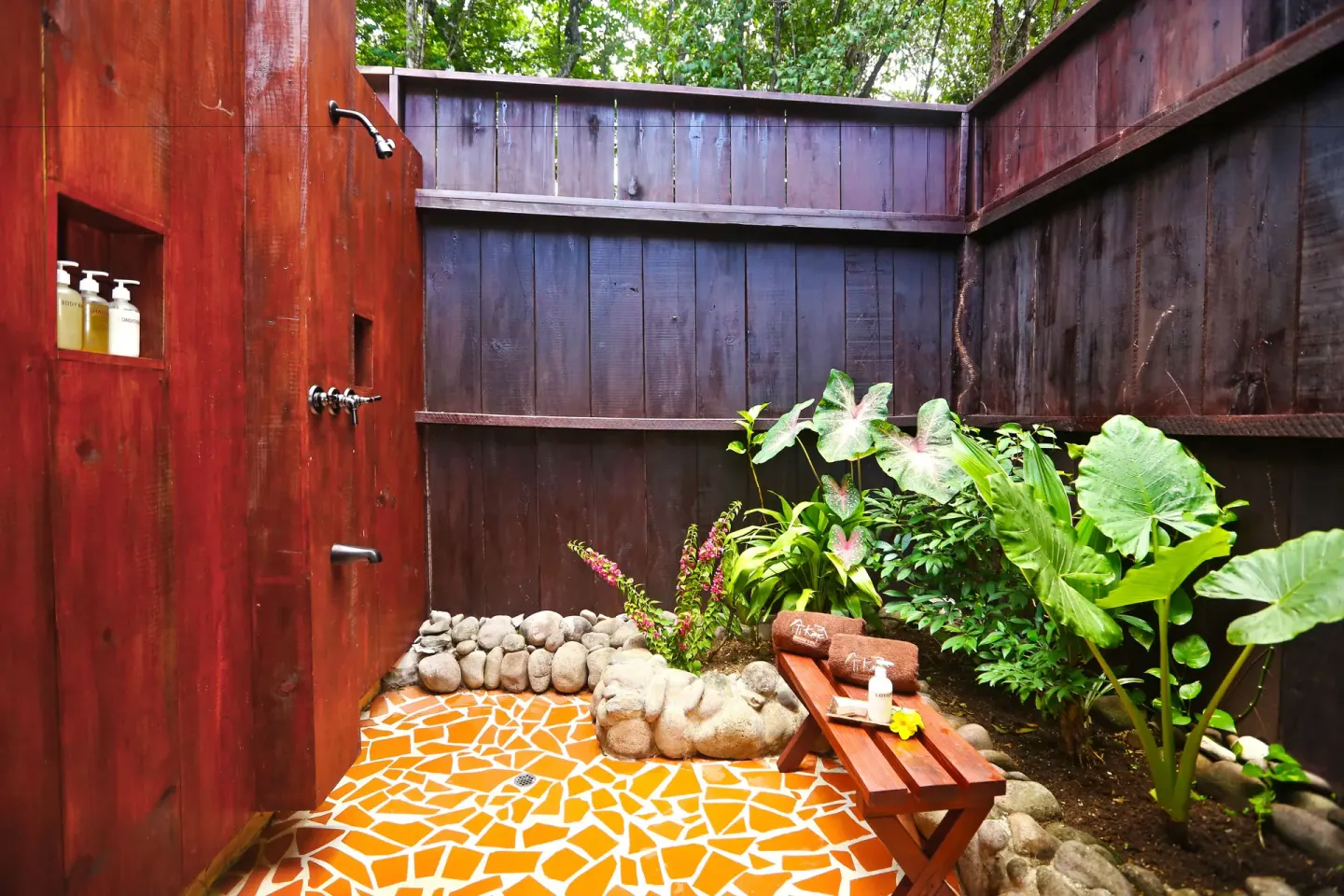 Ocean View Room outdoor shower with tropical plants at Ti Kaye Resort & Spa.