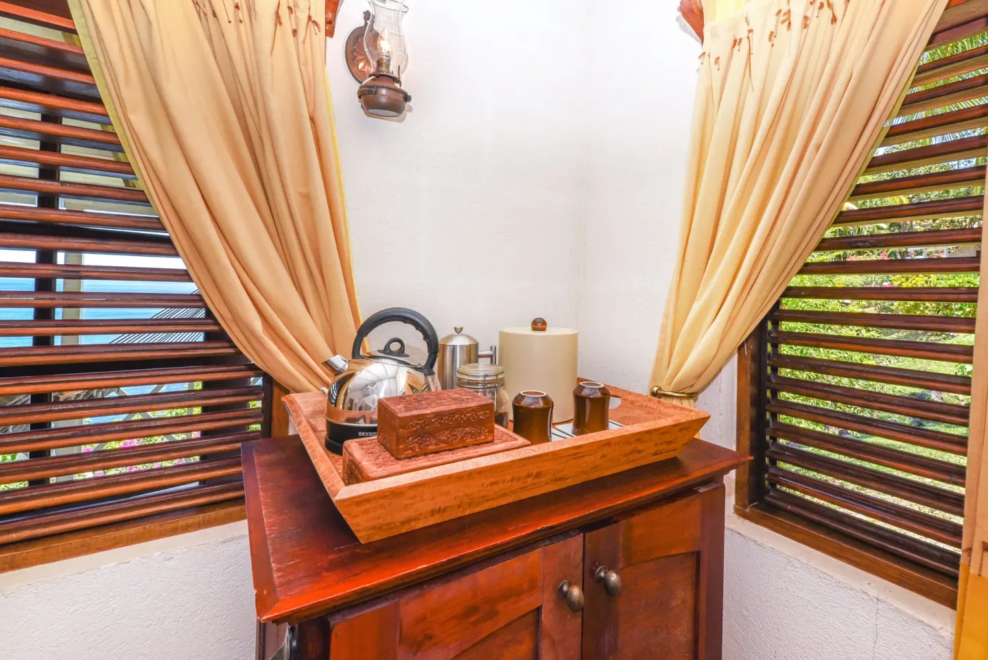 Ocean View Room tea and coffee tray by shuttered windows at Ti Kaye Resort & Spa.