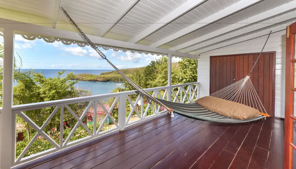 Ocean View Room veranda with hammock and sea view at Ti Kaye Resort & Spa.