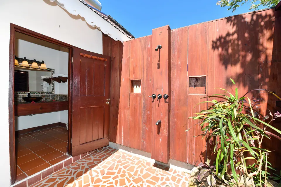 Private outdoor shower beside an Ocean View room at Ti Kaye Resort & Spa.
