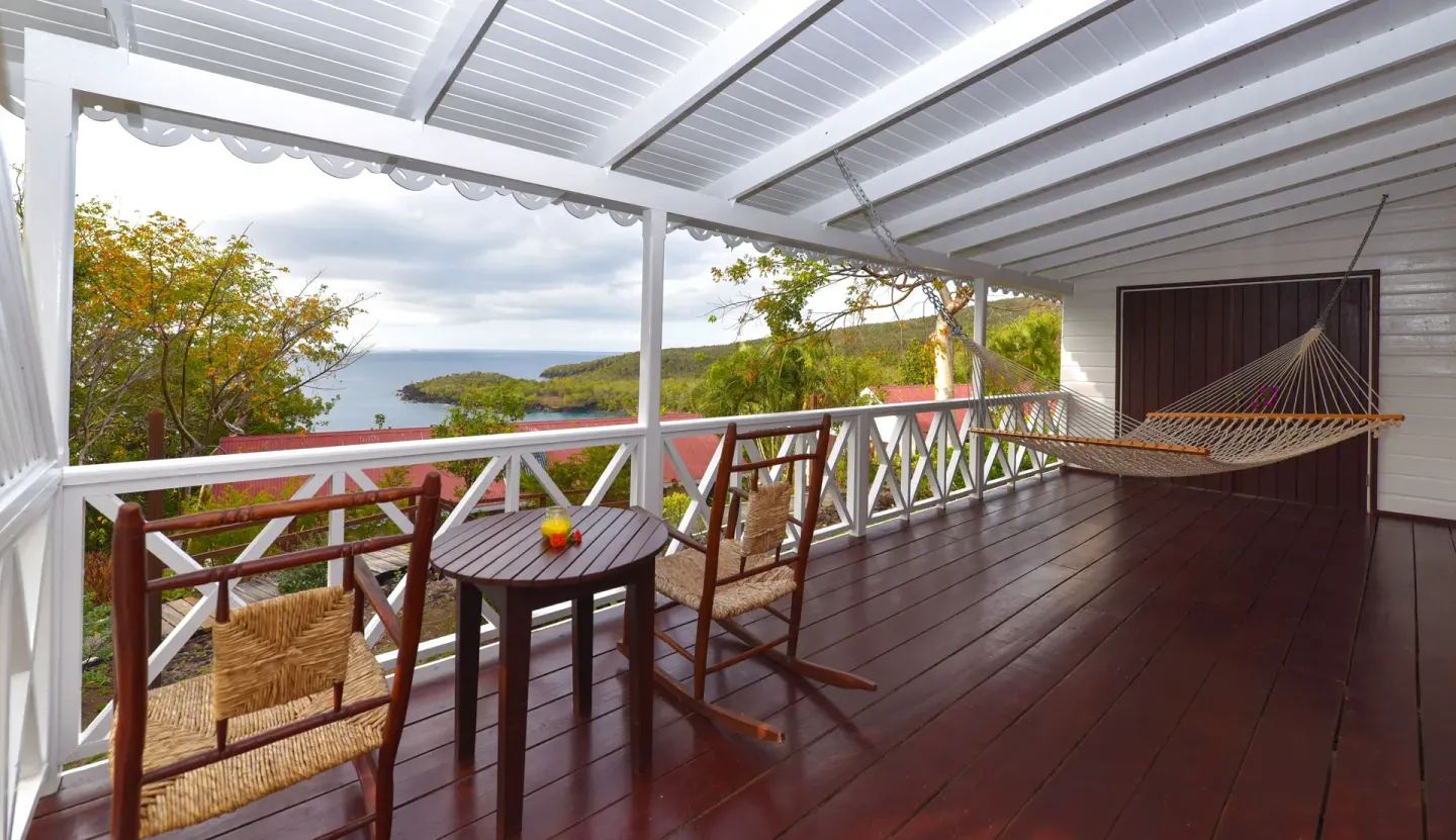 Ocean View room veranda with hammock and ocean outlook at Ti Kaye Resort & Spa.