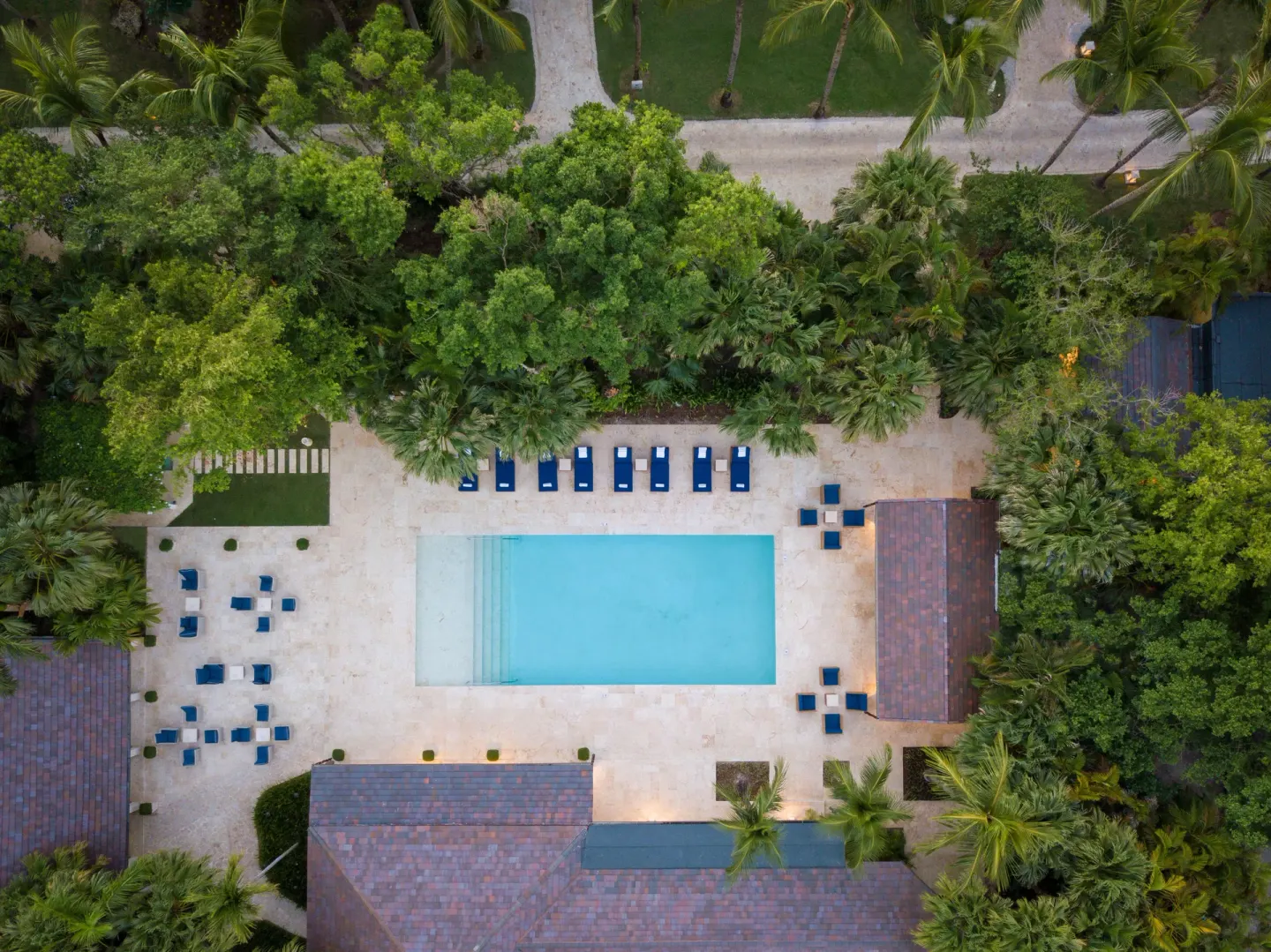 Aerial view of the pool courtyard and loungers at Tortuga Bay Hotel.