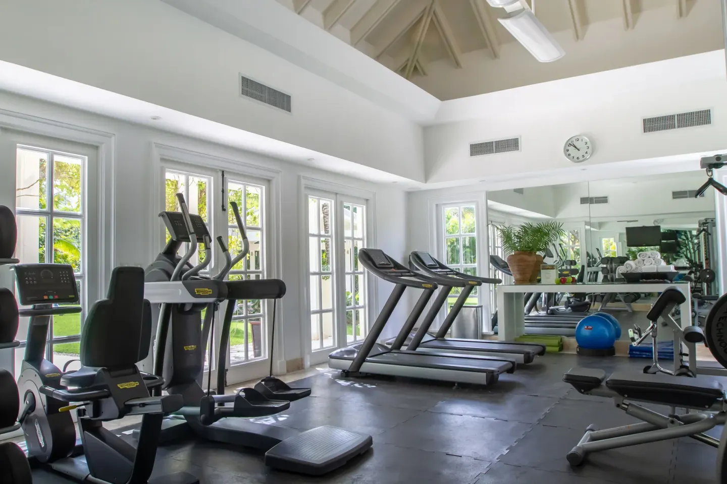 Fitness room with treadmills and windows at Tortuga Bay Hotel.