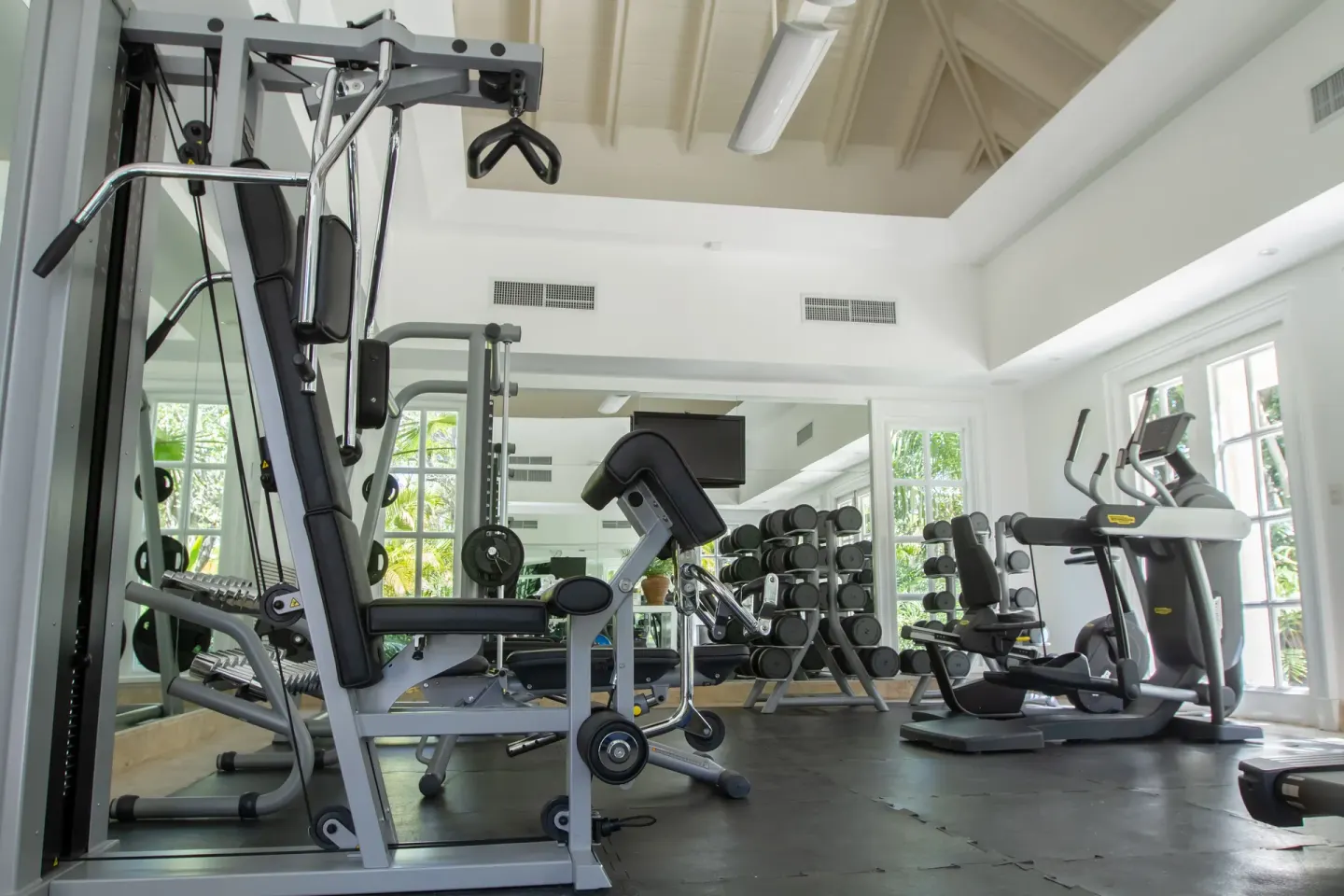 Gym with strength machines, dumbbells, and cardio equipment at Tortuga Bay Hotel.