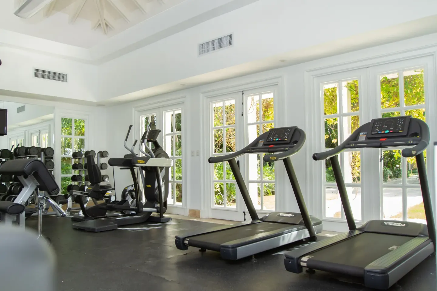 Two treadmills and cardio machines in the gym at Tortuga Bay Hotel.