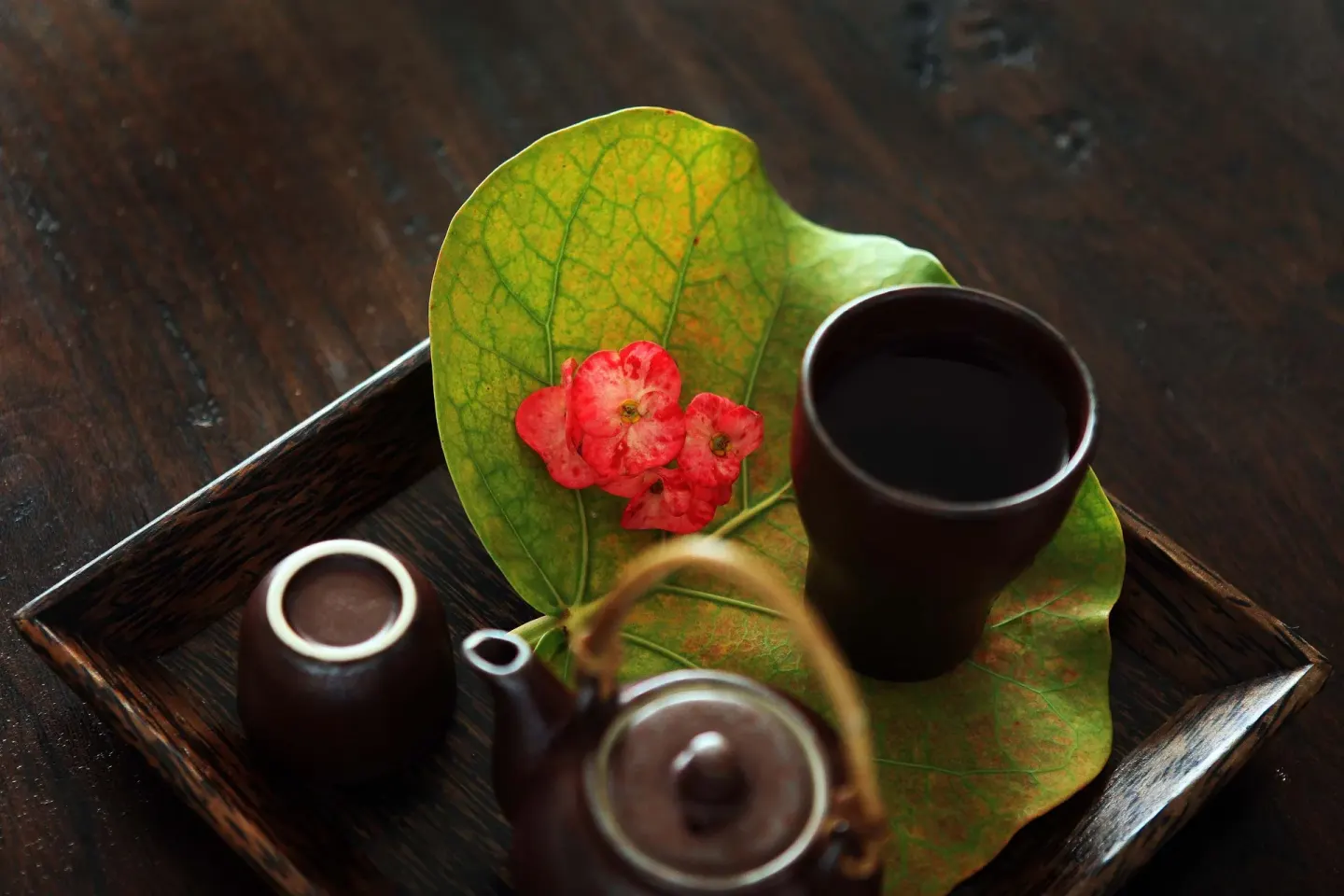 Tea service with flowers on a wooden tray at Tortuga Bay Hotel.