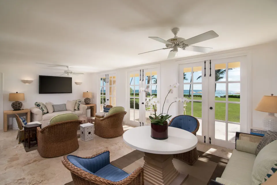 Beach Front Two Bedrooms Suite living room with French doors at Tortuga Bay Hotel.