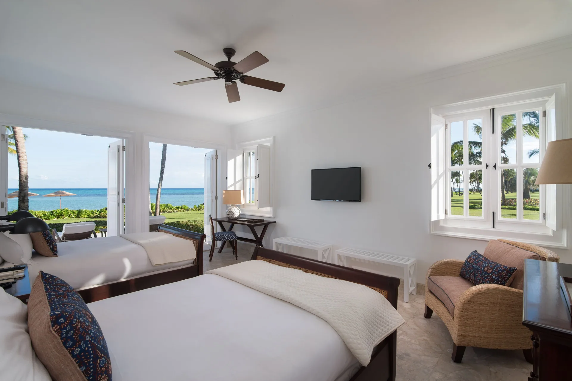 Beach Front Two Bedrooms Suite twin bedroom with ocean and lawn views at Tortuga Bay Hotel.