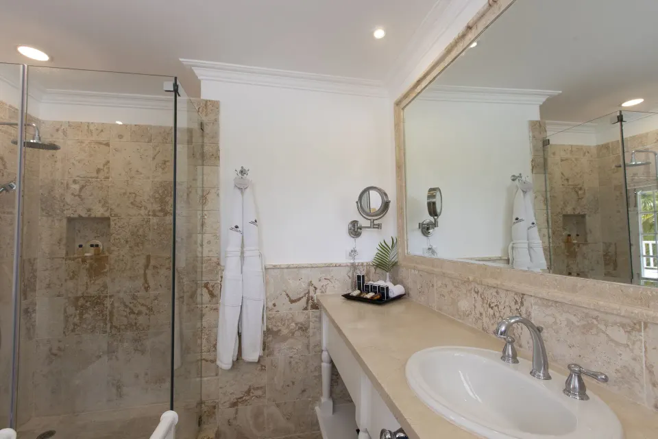 Ocean View Junior Suite marble bathroom with shower at Tortuga Bay Hotel.