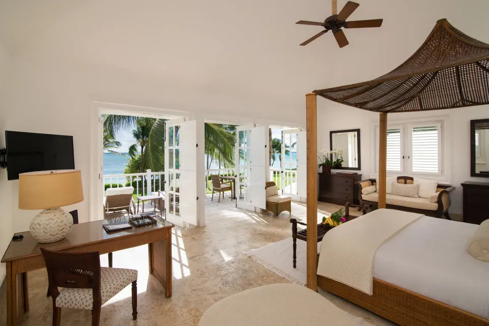 Ocean View Junior Suite bedroom with balcony and sea view at Tortuga Bay Hotel.