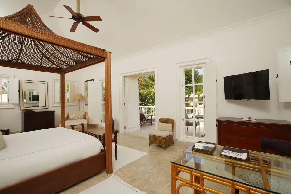 Ocean View Junior Suite king bed and sitting area at Tortuga Bay Hotel.