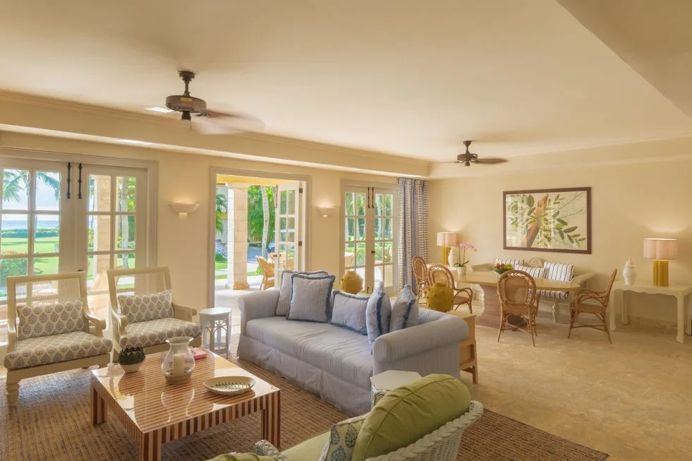 Ocean View Two Bedrooms Suite living room with terrace doors at Tortuga Bay Hotel.