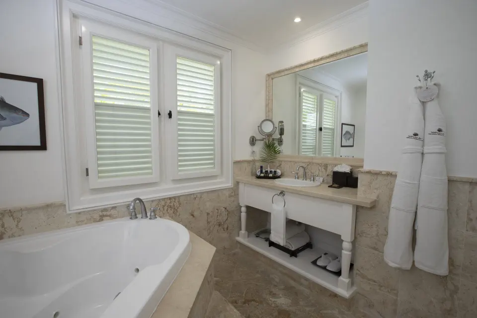 Ocean View Two Bedrooms Suite bathroom with tub and vanity at Tortuga Bay Hotel.