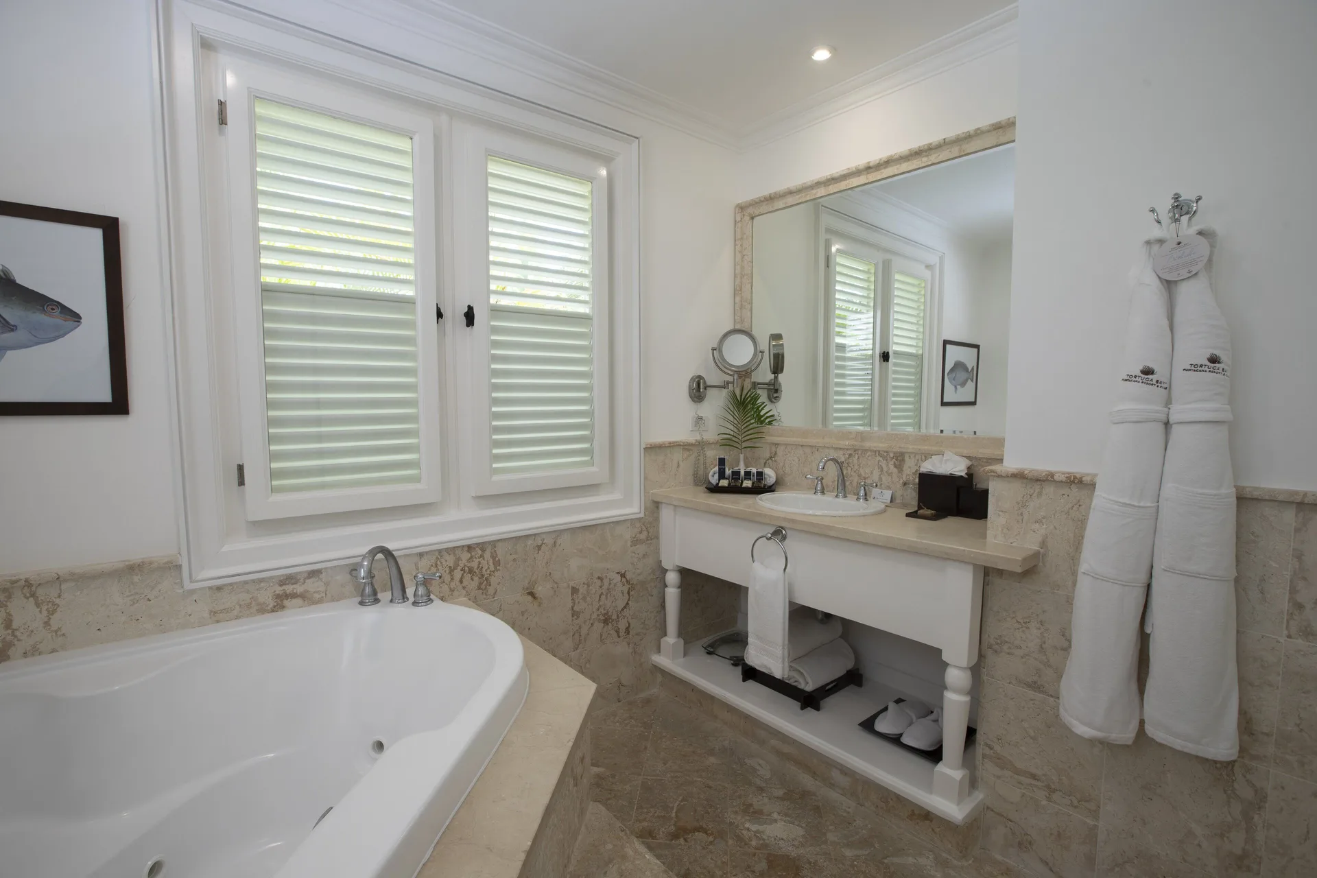 Ocean View Two Bedrooms Suite bathroom with tub and vanity at Tortuga Bay Hotel.